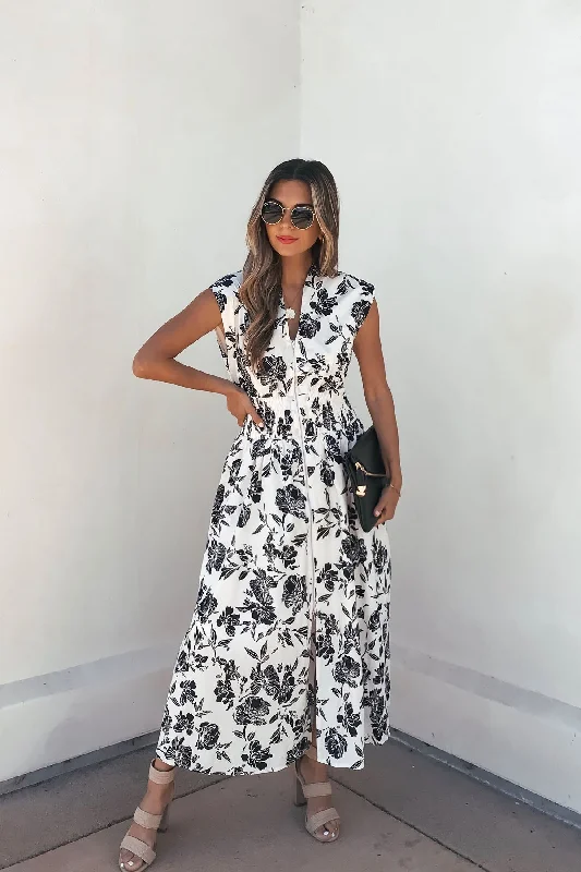 Midi dresses with button - front designs for a classic touch White and Black Floral Print Smocked Midi Dress Midi dresses with button - front designs for a classic touch White and Black Floral Print Smocked Midi Dress